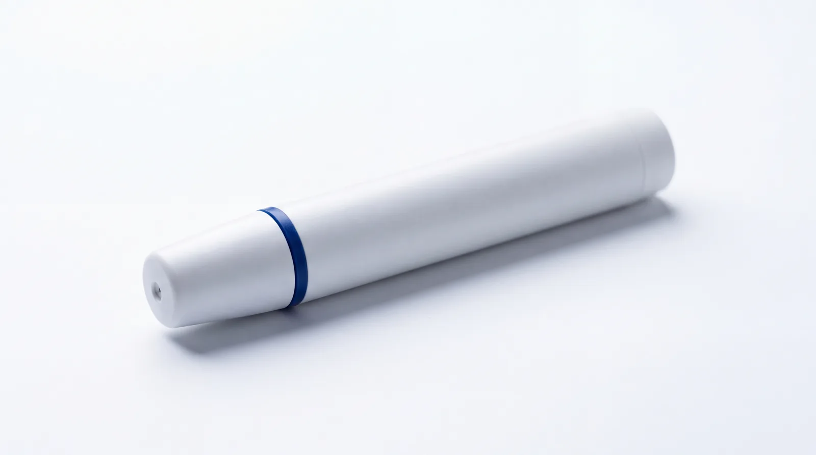 Unmarked white medical autoinjector pen
